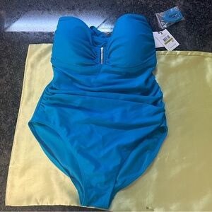 NWT one piece Calvin Klein bathing suit. Can be worn different ways. Turquoise